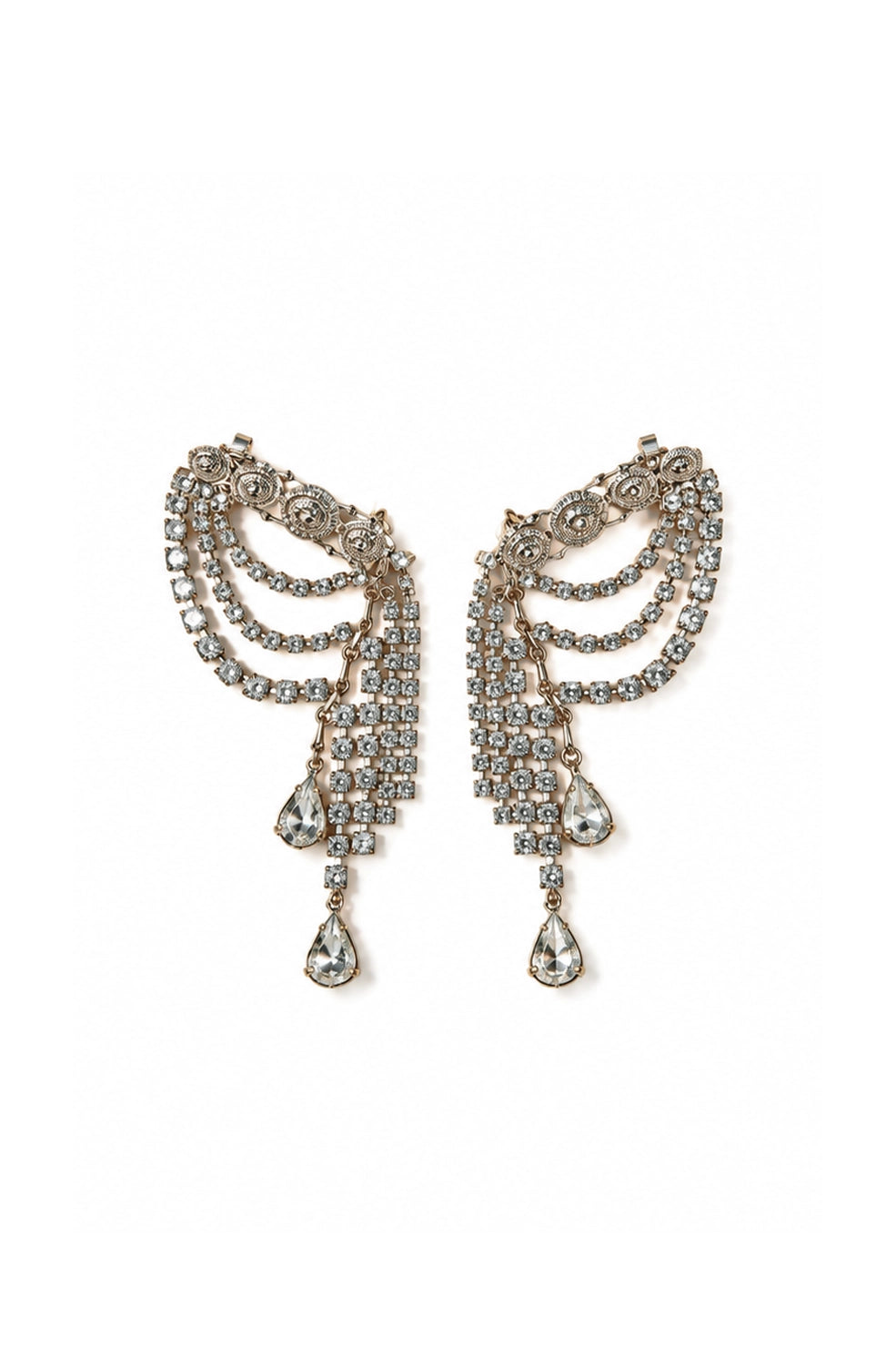A pair of ornate DYLANLEX silver-tone dangle earrings adorned with clear rhinestones, featuring curved layered bands and teardrop-shaped drops, set against a plain white background.