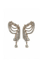 A pair of ornate DYLANLEX silver-tone dangle earrings adorned with clear rhinestones, featuring curved layered bands and teardrop-shaped drops, set against a plain white background.